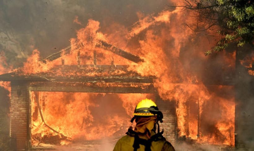 Calif. wildfires roar out of control, whipped by Santa Ana winds