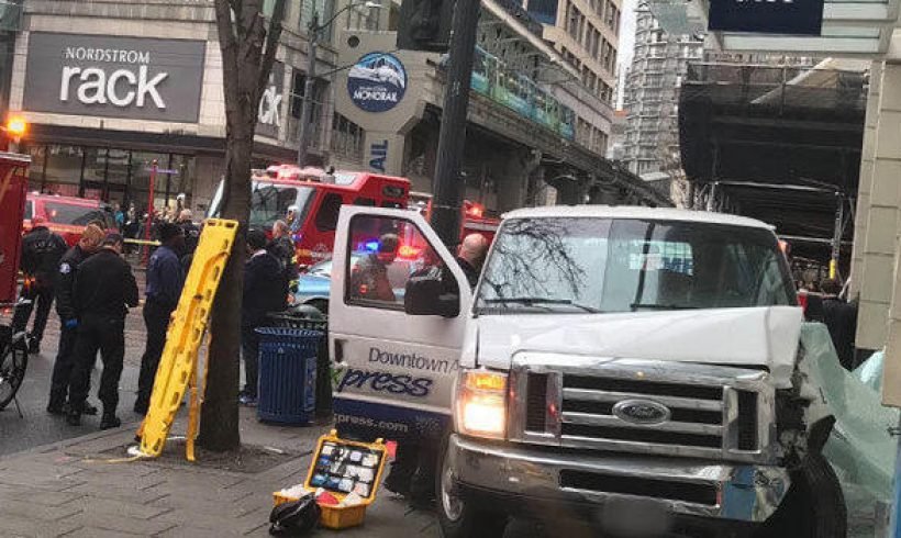 Van crashes into building in downtown Seattle Van crashes into building in downtown Seattle
